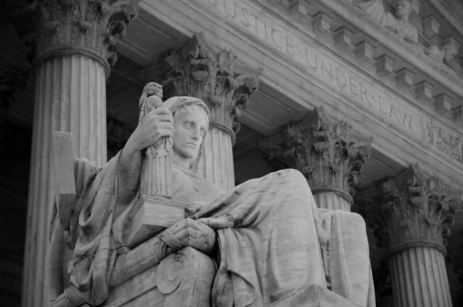 Statue overlooking the steps of The Supreme Court