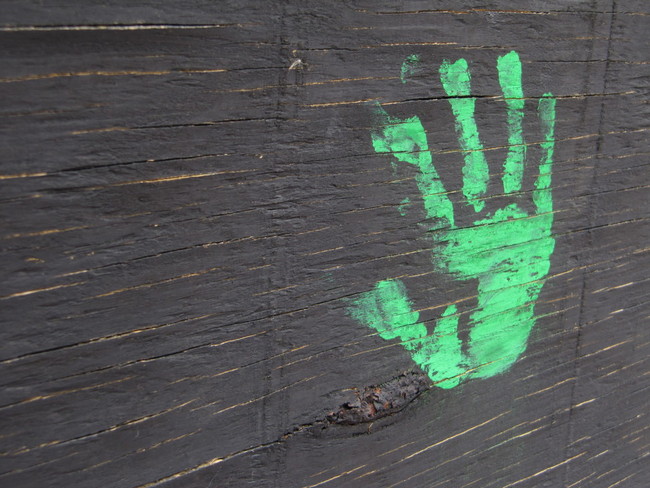 A lone hand imprint decorates the wall opposite the park in Reston Town Center.