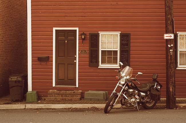 A motorcycle sits outside a small residence in Leesburg
