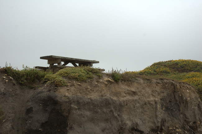 A lone picnic table overlooking the fog