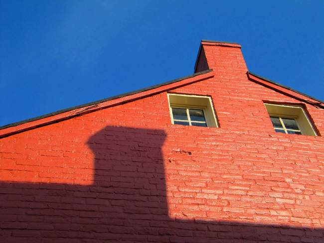The sun catches the side of a house in Leesburg, VA.